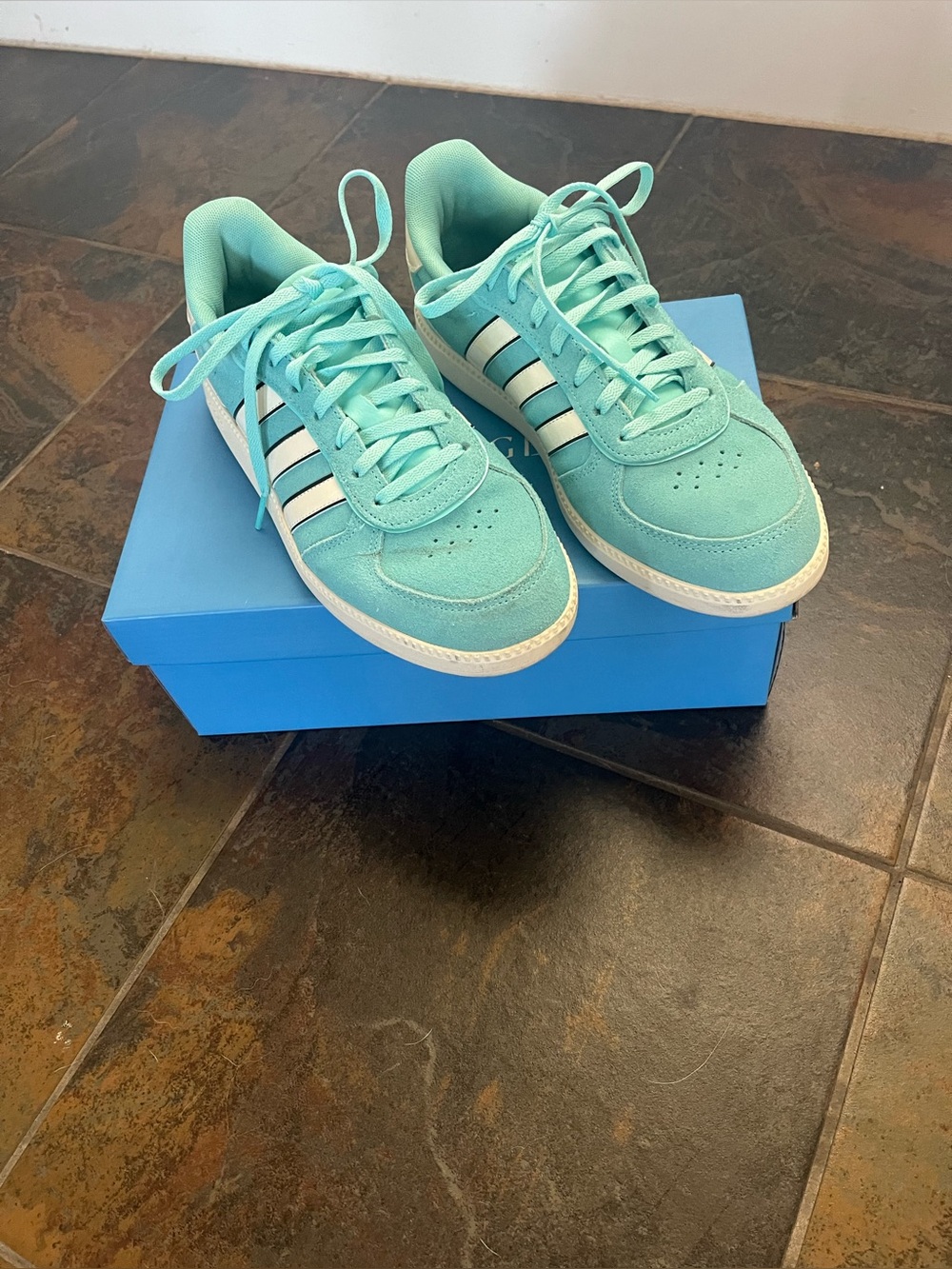Women’s Adidas turquoise sneakers, worn once.